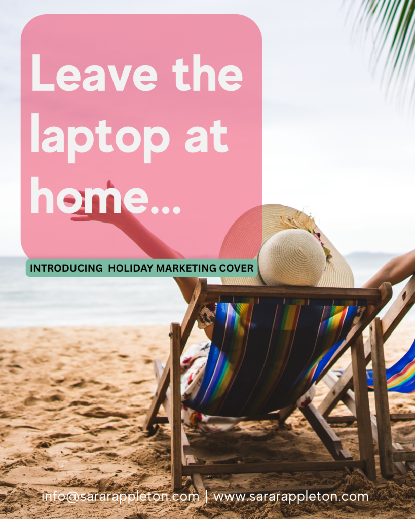 A lady on the beach in a deckchair with her arms out giving a sign of freedom and happiness